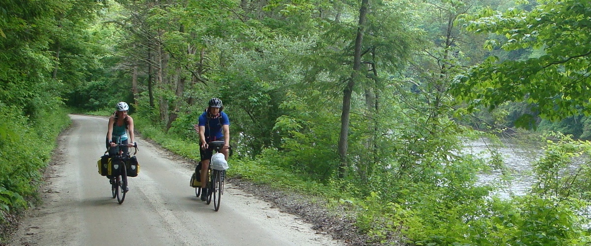 Long-distance bike travelers passing through town on River Road.